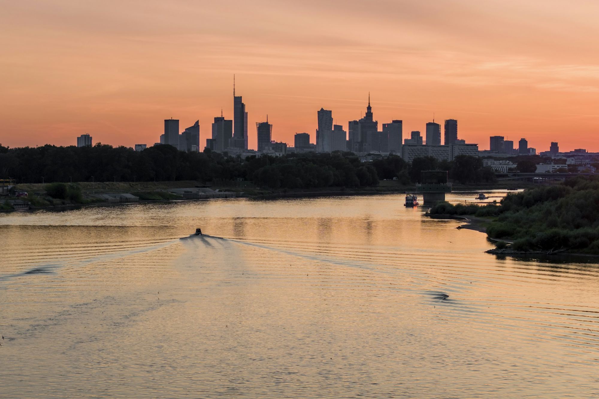 Warsaw skyline seen from the Vistula river at sunset